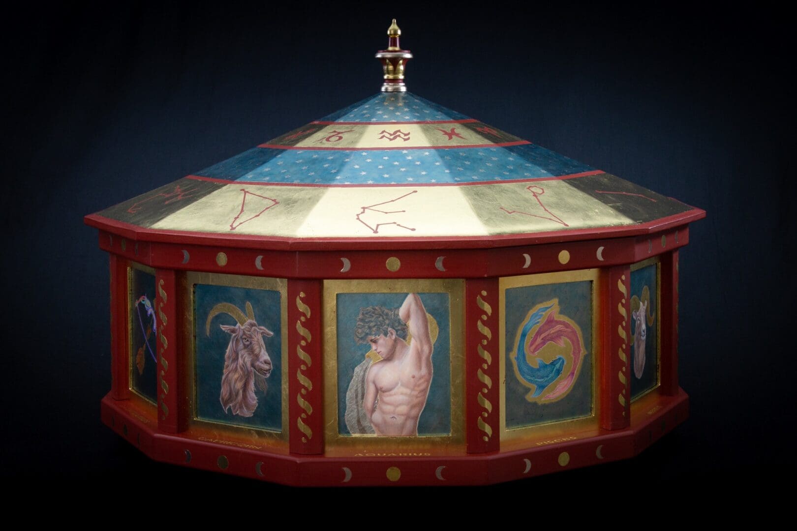 A painted carousel with various images of people.